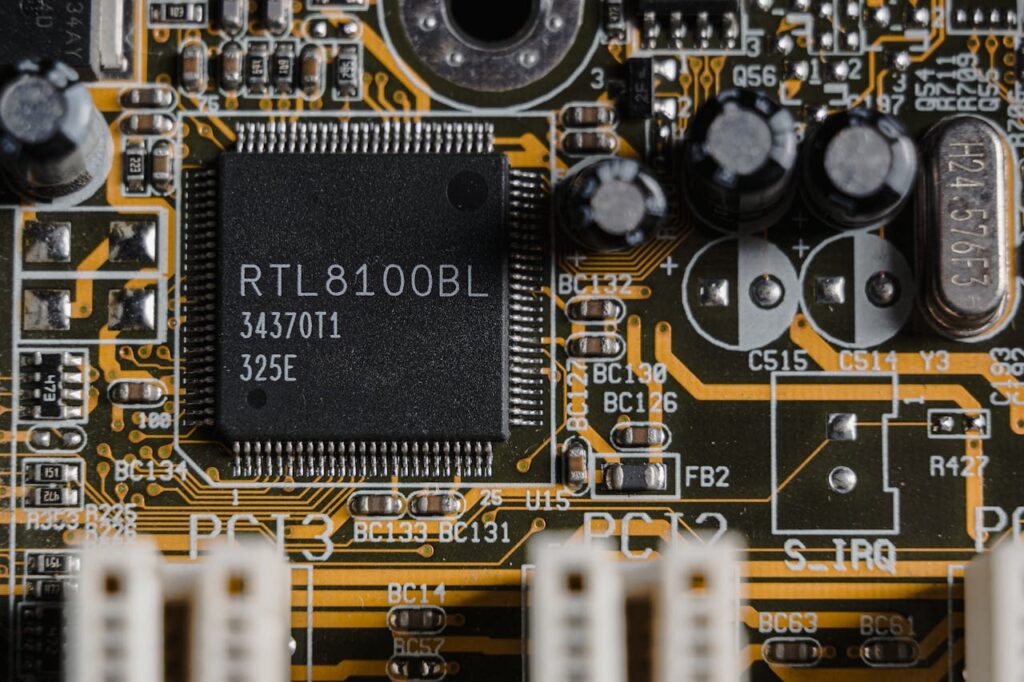 Detailed image of a motherboard highlighting a RTL8100BL microchip.